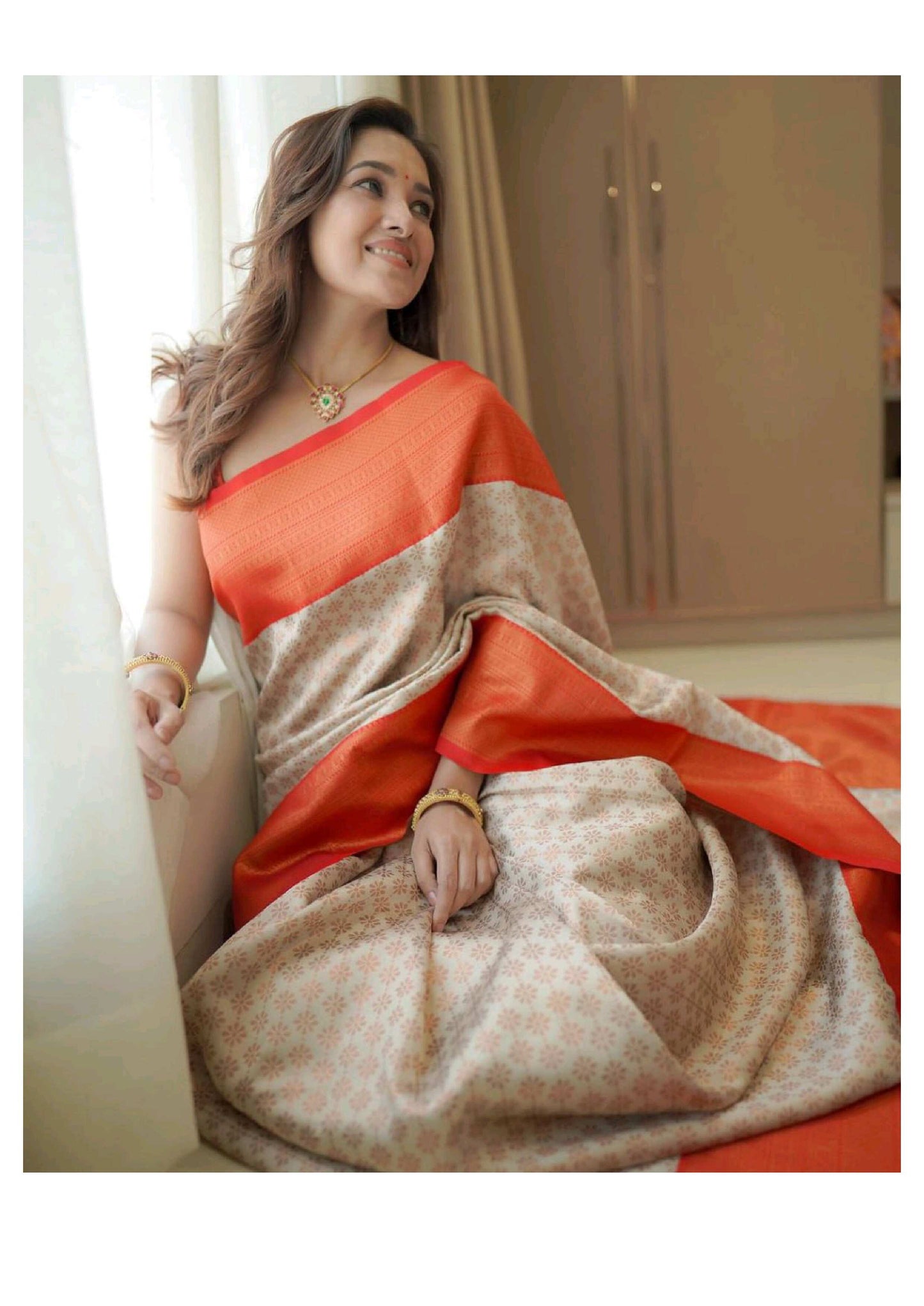 Graceful Cream & Orange Cotton Silk Saree with Subtle Floral Weave